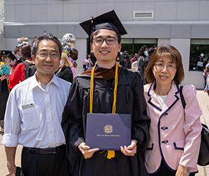 Sungkeel Yamada and his parents at Commencement 2021